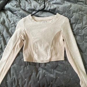 Cream colored long sleeve crop top